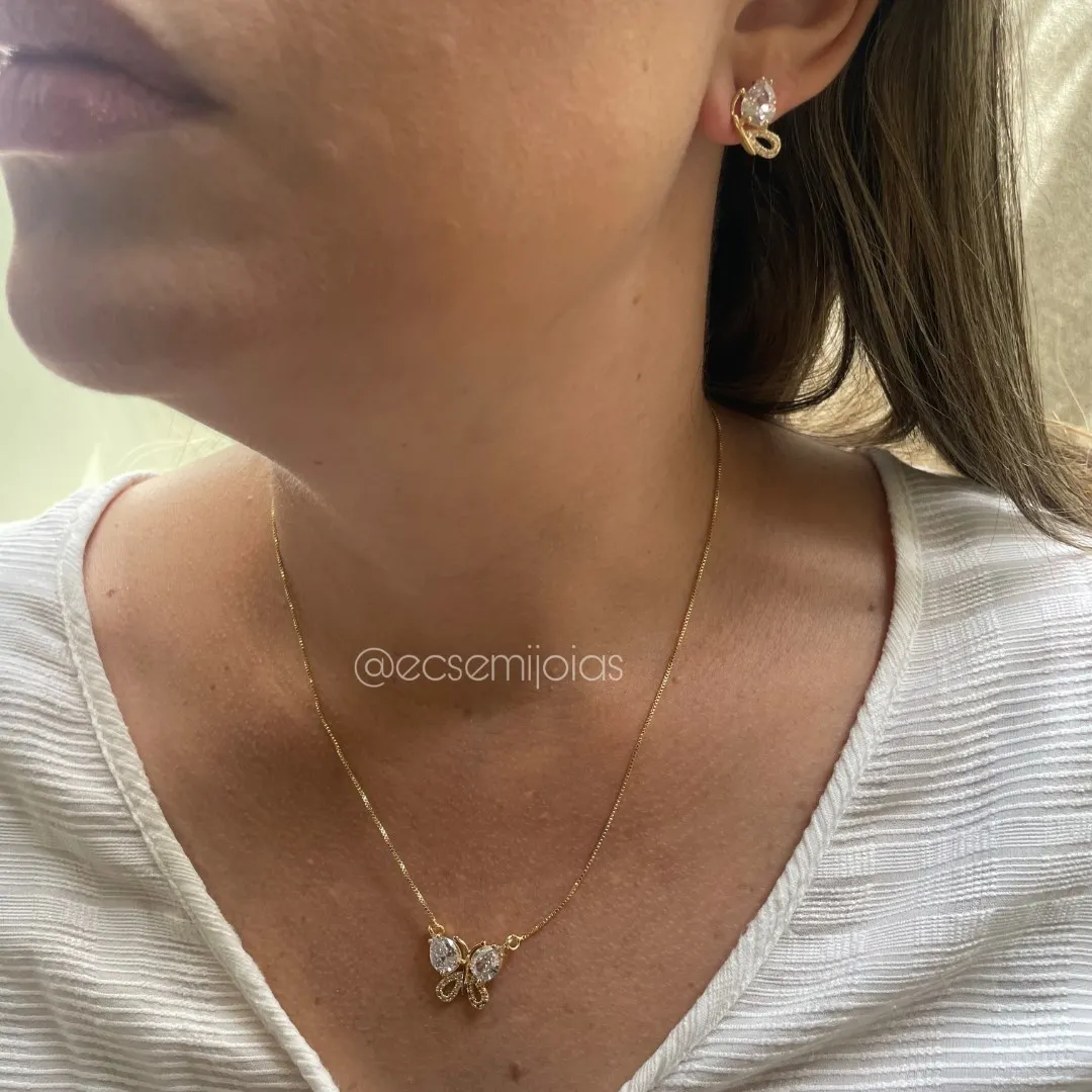 Conjunto de brinco e colar de borboleta com gotas maiores nas asas e cravejado em baixo - banhado a ouro 18k