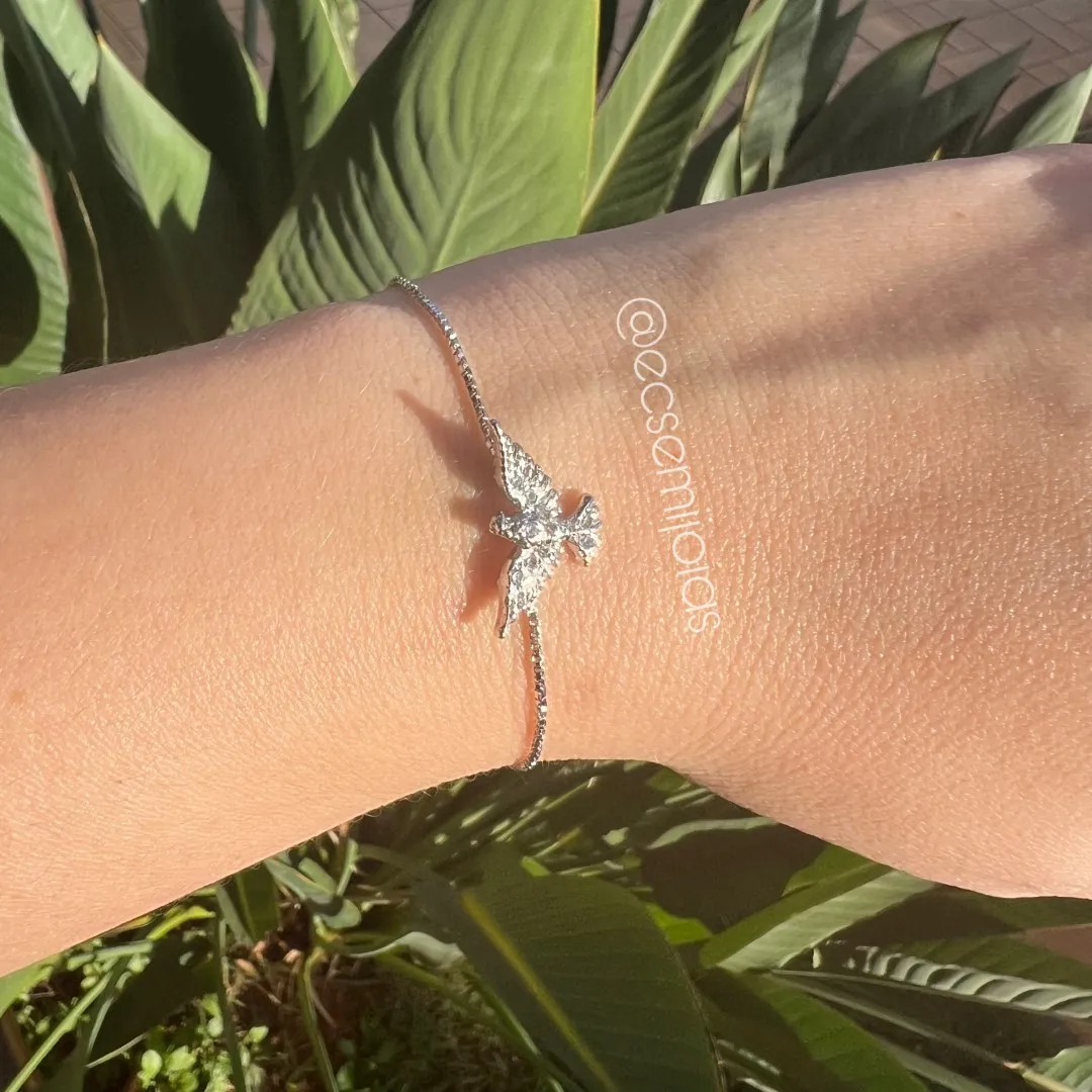 Pulseira com pomba cravejada com fecho ajustável - banhado a ródio branco