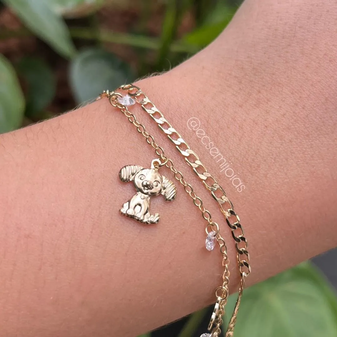 Pulseira dupla com elo grumet e português com cachorro e zircônias penduradas - banhado a ouro 18k