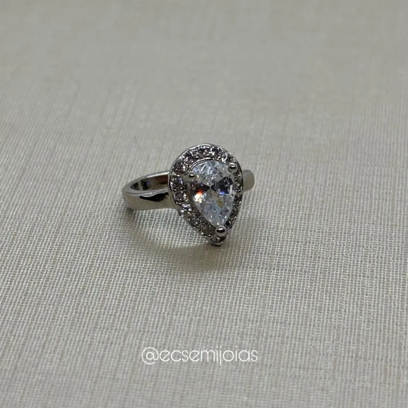 Piercing fake com zircônia gota 4x6mm maior cravejado em volta - banhada a ródio branco